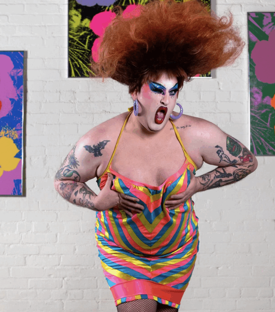 Drag Queen featured on Camp Wannakiki wearing Divine's Dress at an art event in Boston